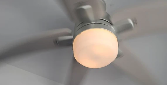 Modern ceiling fan light fixture, showcasing the benefits of professional light fixture replacement services.