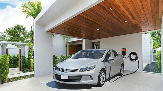 Silver electric vehicle charging at residential charging station in Bowie, MD, highlighting electrical panel evaluation and load management.