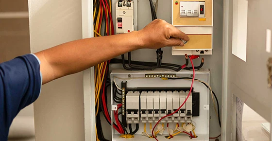 Technician working on an electrical panel, representing electrical panel replacement and installation services in Silver Spring MD.