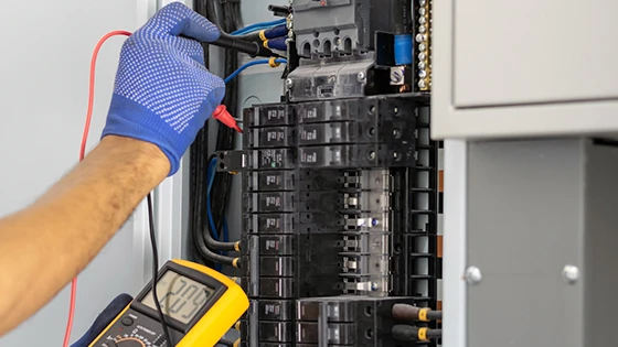 Electrician performing routine electrical system inspection in Bowie, MD.