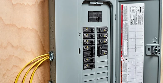 Electrical panel with wiring, representing panel inspections and code compliance services in Fairfax VA
