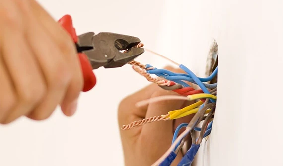 Electrician maintaining electrical wiring and connections in Arlington, VA.